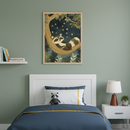 Kid's bedroom with a white bed and headboard against a green wall. Framed art of a raccoon sleeping on a tree branch under a starry night sky hangs centered above the bed. A white floating shelf with books is left, and a nightstand with a lamp and plant is right.