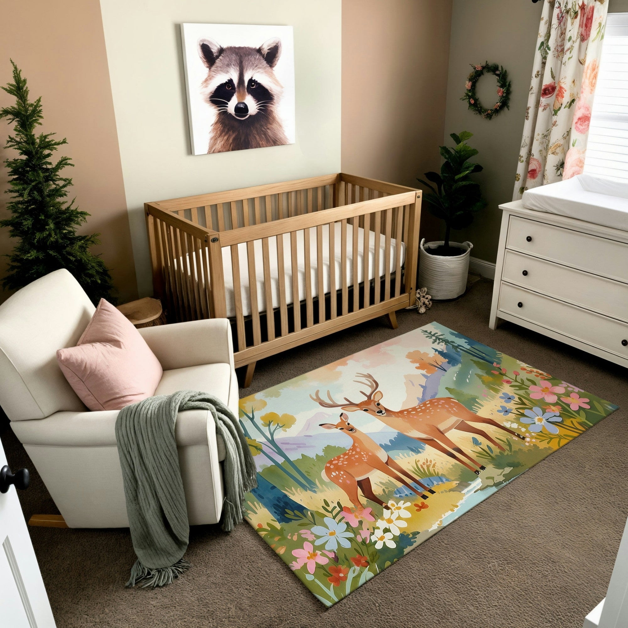 This image showcases a cozy nursery with a warm, natural aesthetic. The room features a wooden crib, a white armchair with a pastel pink pillow, and a dresser, all styled with neutral and earthy tones. The standout piece is a colorful area rug depicting two deer—a buck and a doe—standing in a scenic meadow surrounded by wildflowers, trees, and distant mountains. A raccoon portrait hangs on the wall, adding to the woodland theme.