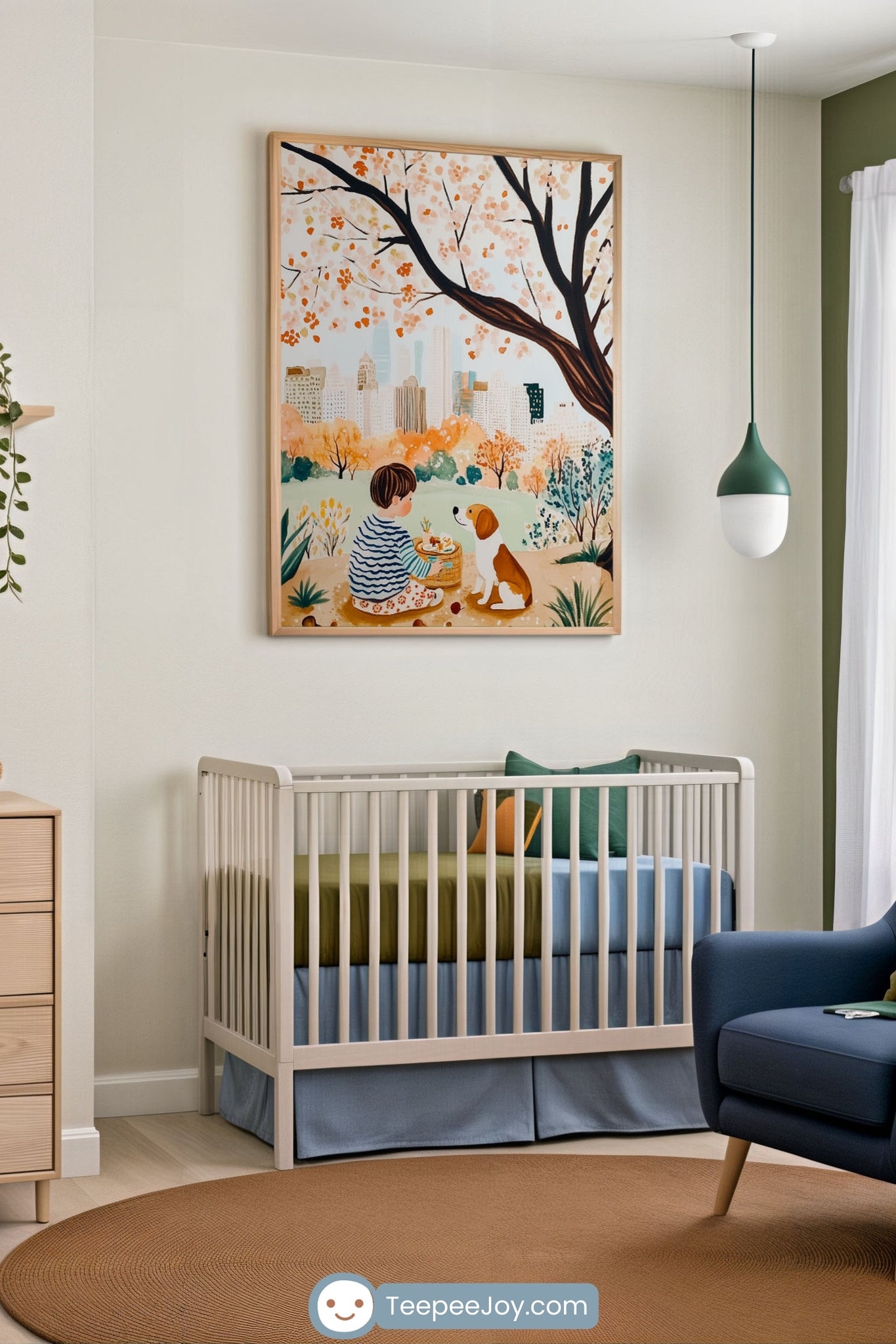 Modern nursery with a light crib dressed in olive green and sky blue bedding, beneath a large framed art print of a child having a picnic with a dog under a blooming tree, with a city skyline in the background. The room blends natural and urban elements, featuring soft wood furniture, a rust-toned rug, and green accent decor.