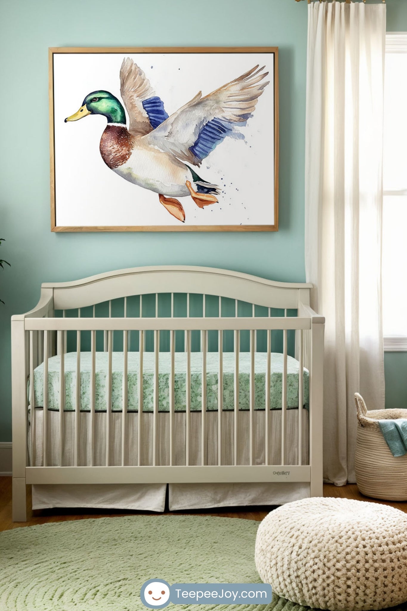 This nursery image showcases soft, serene decor in pastel hues, featuring a striking watercolor painting of a flying mallard duck as the centerpiece above the crib. The duck's vivid green head, blue wings, and detailed plumage contrast beautifully with the muted wall and cozy furnishings, creating a tranquil yet lively atmosphere for the space.