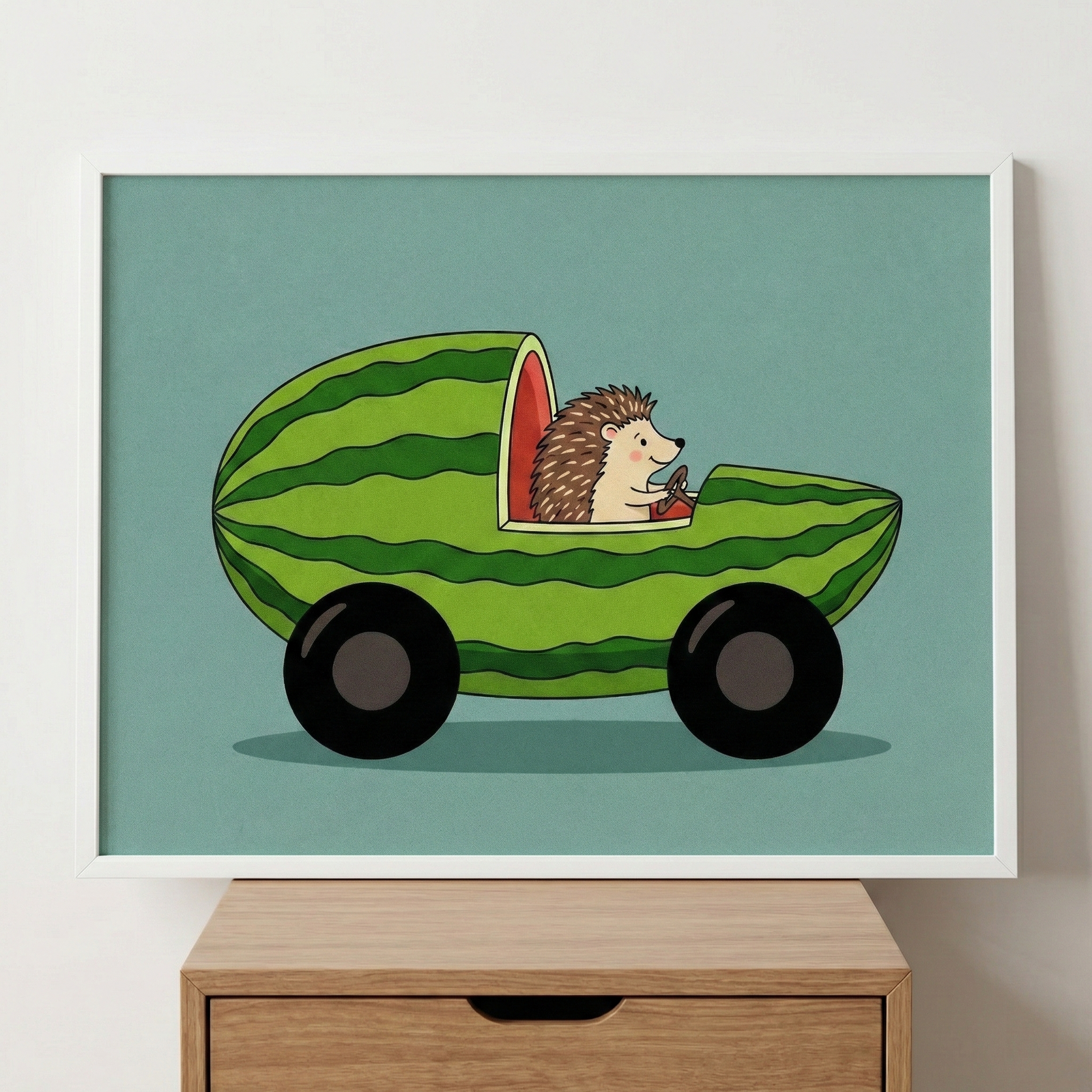 Framed hedgehog in a watermelon car wall art in a white frame, displayed sitting on top of a wooden cabinet against a plain white wall.