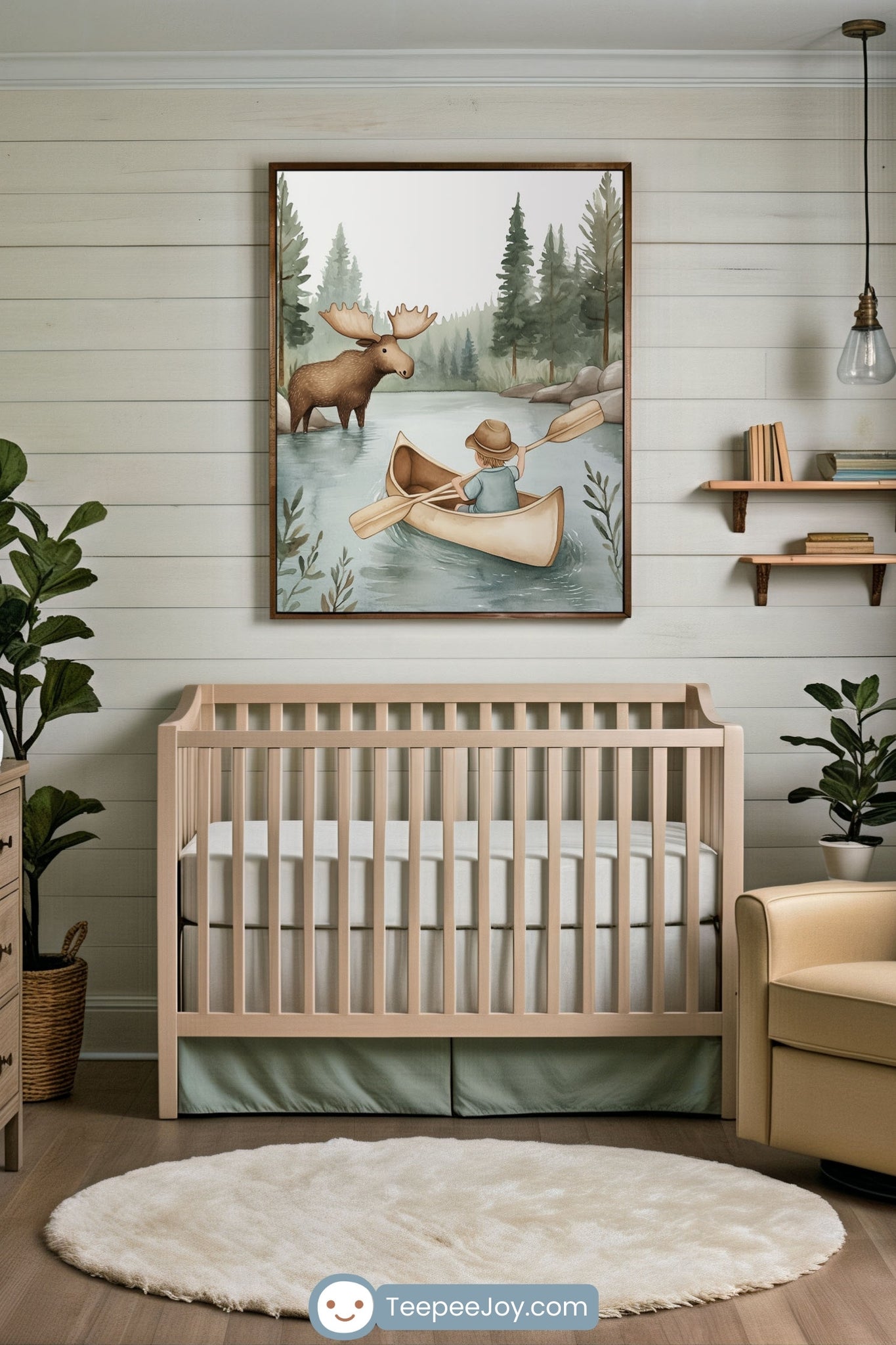 NNeutral-toned nursery with a wooden crib beneath a large wall art print of a child paddling a canoe toward a moose in a forest river scene. The room features soft green accents, a round plush rug, indoor plants, and floating bookshelves, creating a cozy woodland-themed space.