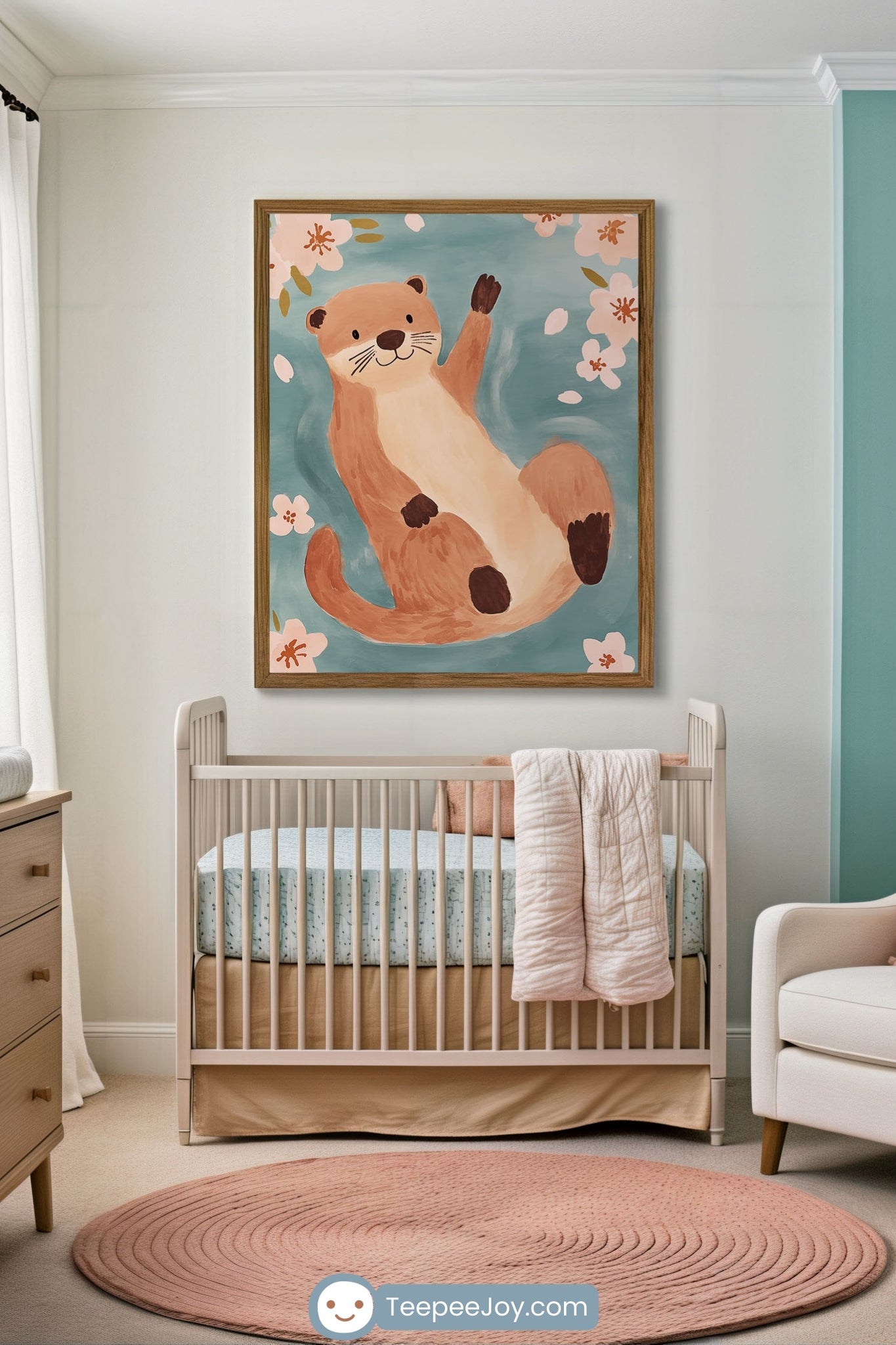Cozy nursery with a soft pink round rug and a light wood crib dressed in blue dotted bedding, set beneath a playful framed illustration of an otter waving while floating among pink cherry blossoms on a teal background. The space has a calm, airy vibe with warm neutral tones and light wood furniture.