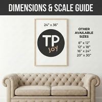 Wall art size guide showing a 24" x 36" “TP JOY” print centered above a tufted beige sofa, with a list of other available sizes including 8" x 12", 12" x 18", 16" x 24", and 20" x 30". Helps visualize scale for framed artwork in home decor settings.