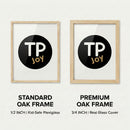Side-by-side comparison of two oak wood frames featuring the “TP JOY” logo in a black circle. The left shows a standard 1/2 inch frame with kid-safe plexiglass, while the right displays a premium 3/4 inch frame with a real glass cover.