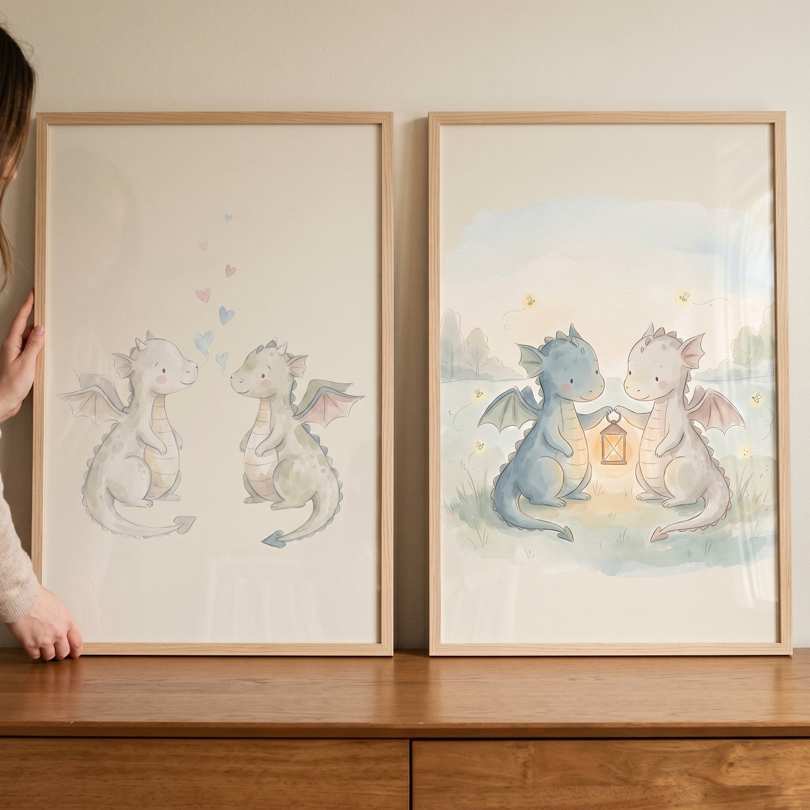 Adorable watercolor baby dragons wall art set of 2 featuring dragons with hearts and others holding a glowing lantern.