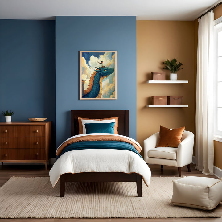 A stylish child's bedroom with contrasting blue and golden tan walls, featuring a dark wood bed with white, teal, and burnt orange bedding on a textured cream rug. Above the bed, a framed illustration shows a girl riding atop a large blue dragon with orange fins as they glide through fluffy clouds in a sunlit sky.