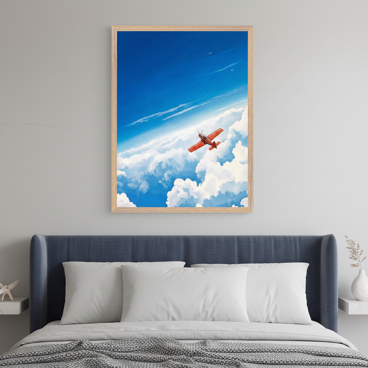Modern bedroom with a blue upholstered bed. A framed illustration of a red propeller plane flying upward through white clouds against a bright blue sky hangs centered above the bed.