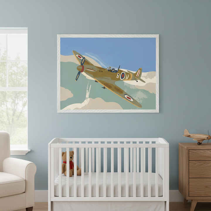 Modern nursery with a white crib, cream armchair, and wooden dresser. A large framed print of an olive green and tan vintage-style Spitfire airplane in a blue sky hangs centered above the crib.