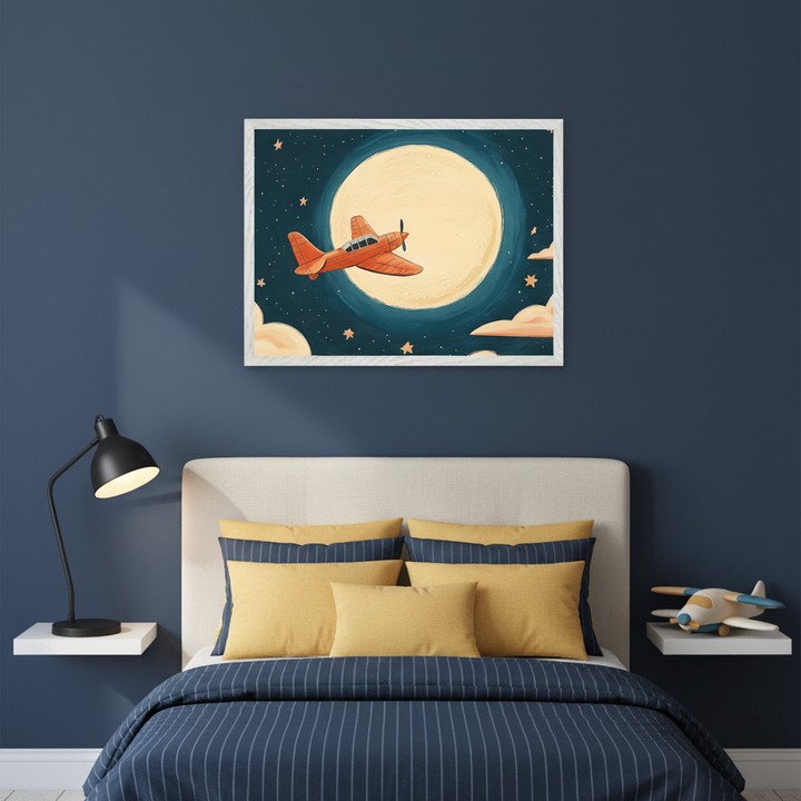 Kid's bedroom with a navy blue wall. A bed with a light headboard, blue striped duvet, and yellow pillows. A framed illustration of an orange airplane flying past a large full moon, stars, and clouds, is centered above the bed. White floating shelves flank the bed; one holds a black lamp, the other a toy airplane.