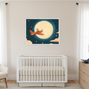 Modern nursery with a white crib and beige bedding. A large framed print of an orange propeller airplane flying under a bright full moon in a starry night sky hangs centered above the crib. A wooden dresser is on the right, and a white armchair is on the left.