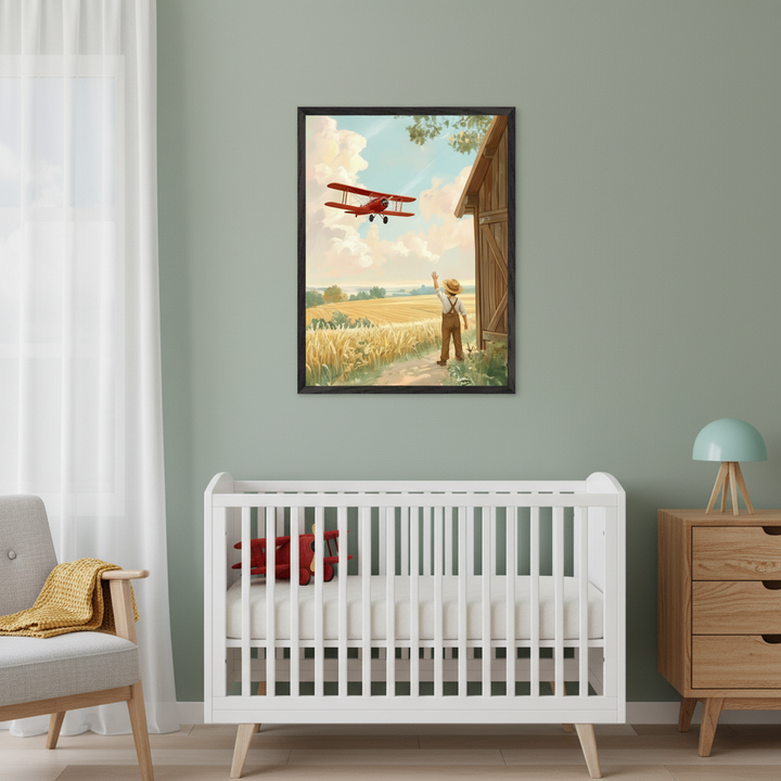 Modern nursery with a white crib, wooden dresser, and gray armchair. A large framed pastoral illustration hangs centered above the crib, depicting a boy waving at a red biplane over a wheat field.