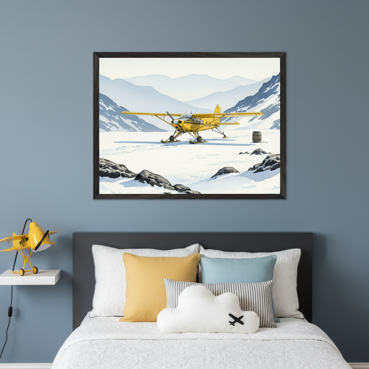 Kid's bedroom with a bed and dark gray headboard. A large framed print of a yellow ski plane on a snowy mountain landscape in a watercolor style hangs centered above the bed. A yellow airplane lamp rests on a white floating shelf to the left.