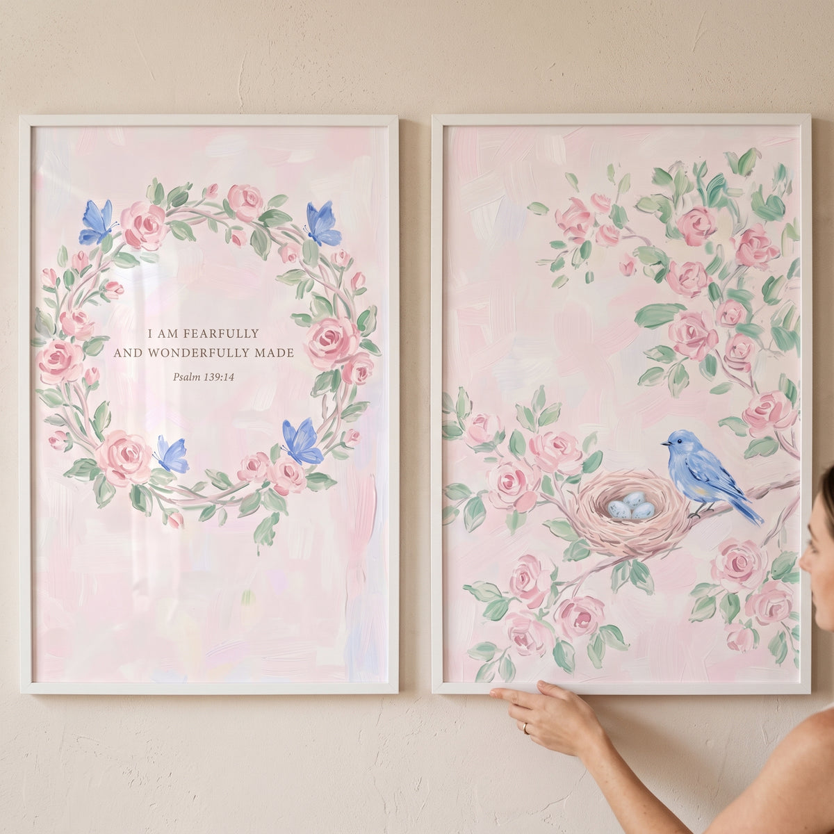 Airy watercolor pink garden wall art set of 2 with pink roses, butterflies, scripture text, and a blue bird by a nest.