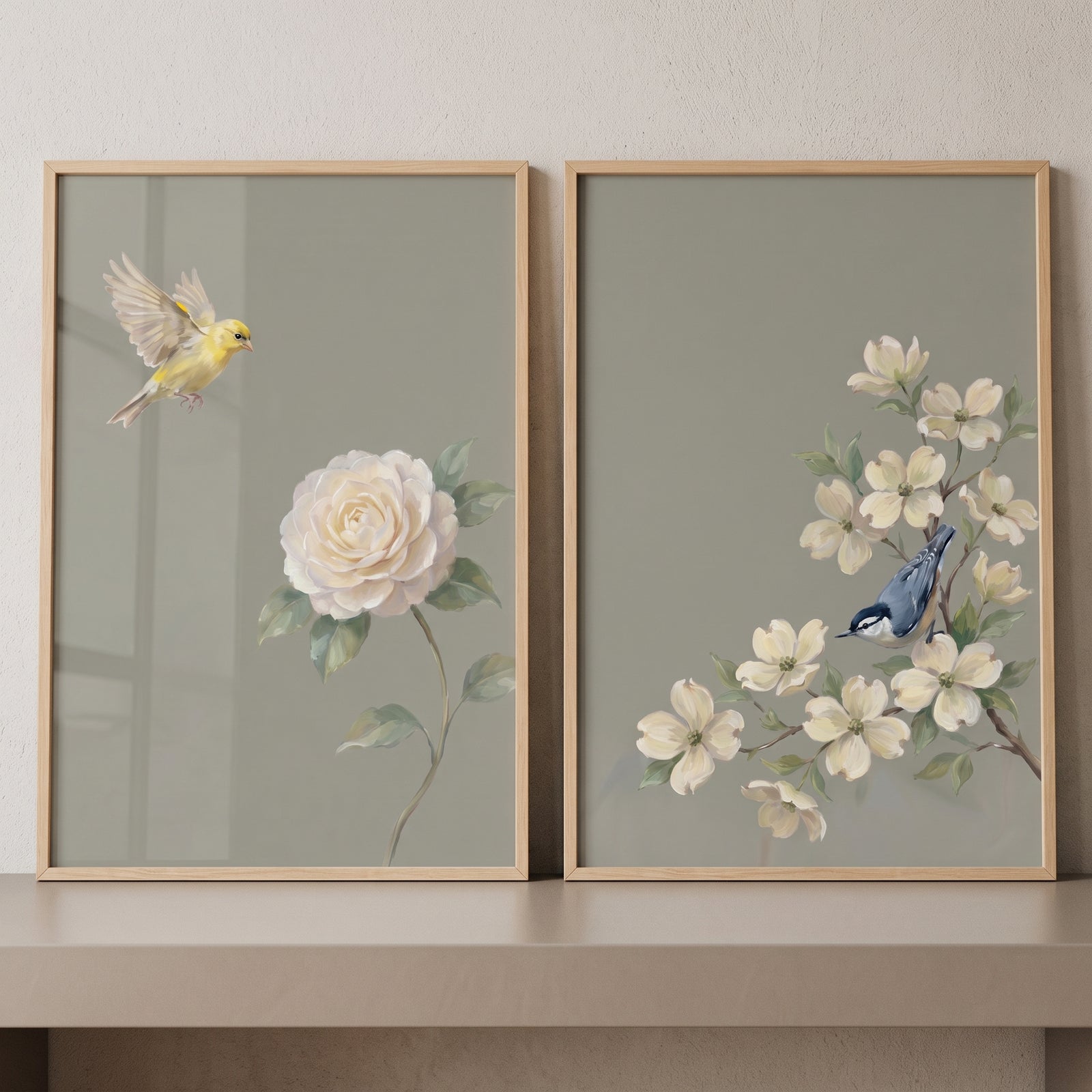 Antique sage botanical bird wall art set of 2 with a yellow bird, white rose, and blue bird in wood frames.