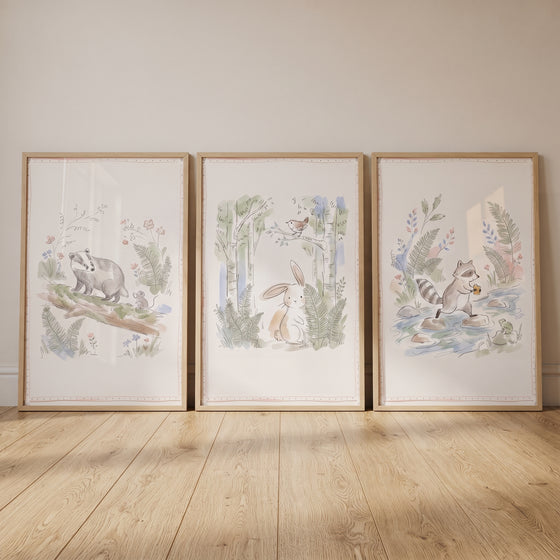 Antique storybook woodland animal wall art set of 3 featuring a badger, rabbit, and raccoon in light wood frames.
