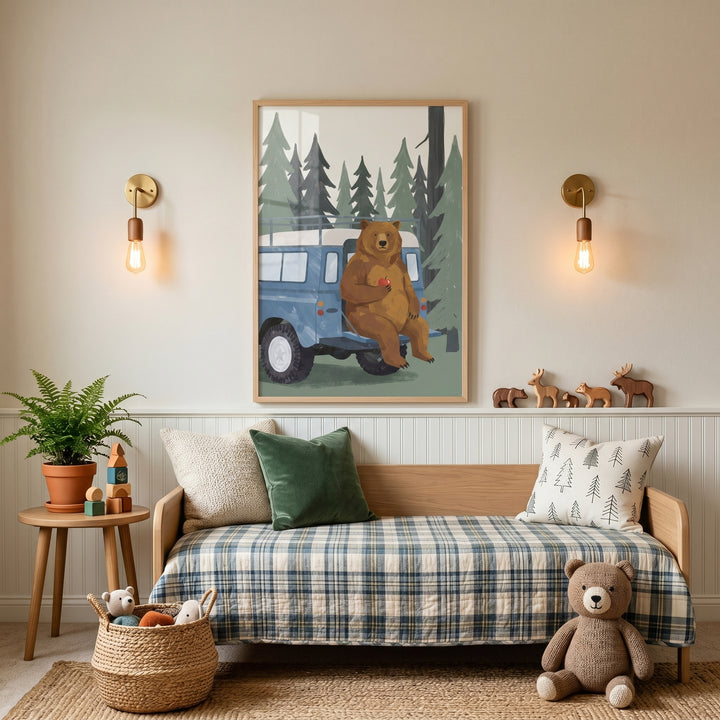 Child's room with apple blue truck bear wall art above a plaid daybed, brass sconces, and a teddy bear.