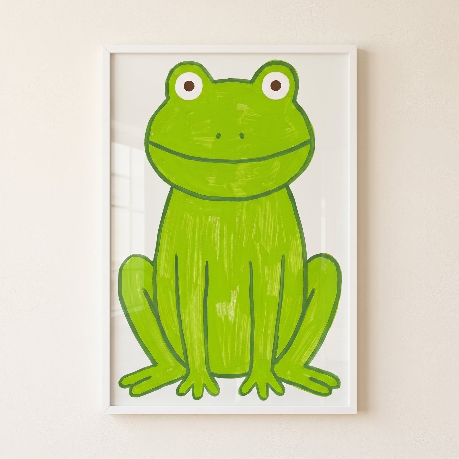 Apple green textured frog wall art features a front-facing, smiling green frog with brown eyes in a white frame.