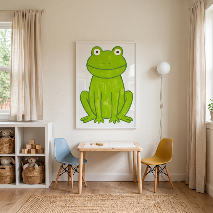 Apple green textured frog wall art hangs above a small wooden table with blue and yellow chairs in a sunny playroom.