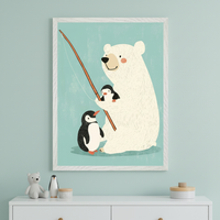 Modern kid's room with a light teal wall. A white-framed whimsical illustration of a polar bear fishing with two penguins hangs centered above a white dresser.
