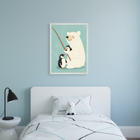 Kid's bedroom with light blue walls. Above a white bed with headboard hangs a framed illustration of a polar bear fishing with two penguins. A white side table, black lamp, and white fox plushie on geometric bedding complete the foreground.