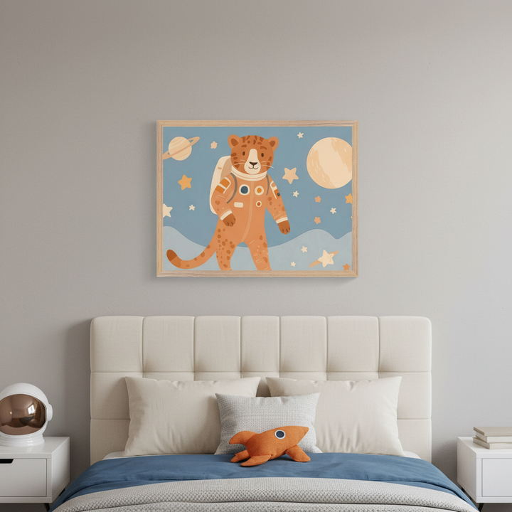 Kid's bedroom with a beige upholstered bed. A framed cartoon print of a cheetah in an astronaut suit among planets and stars hangs centered above the bed. White nightstands flank the bed, one with an astronaut helmet, one with books.