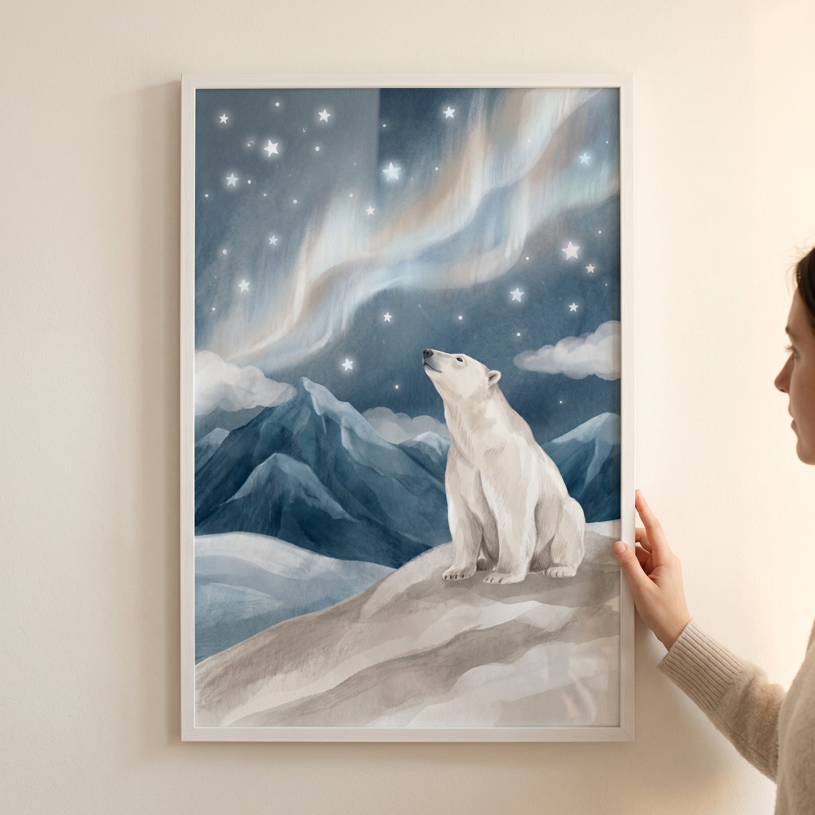 Framed aurora sky polar bear wall art features a bear gazing at stars and northern lights above snowy mountain peaks.