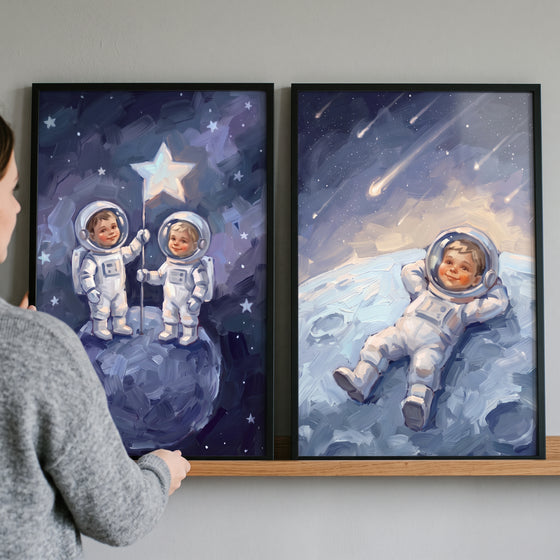 Azure moonlit baby astronaut wall art set of 2 depicts infants in spacesuits exploring celestial bodies and stars.