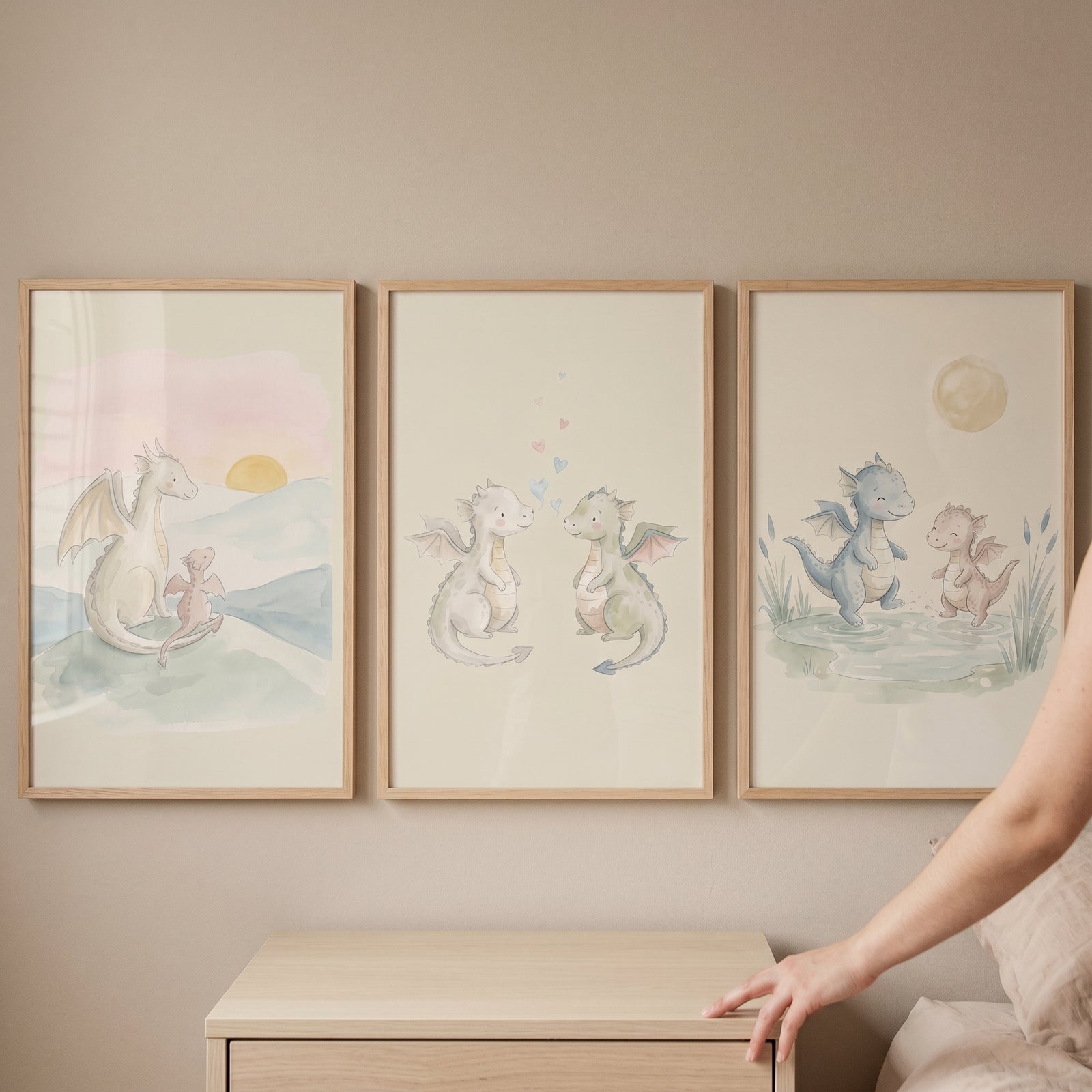 Baby dragon wall art set of 3 in light wood frames features cute watercolor dragons in soft pastel colors.
