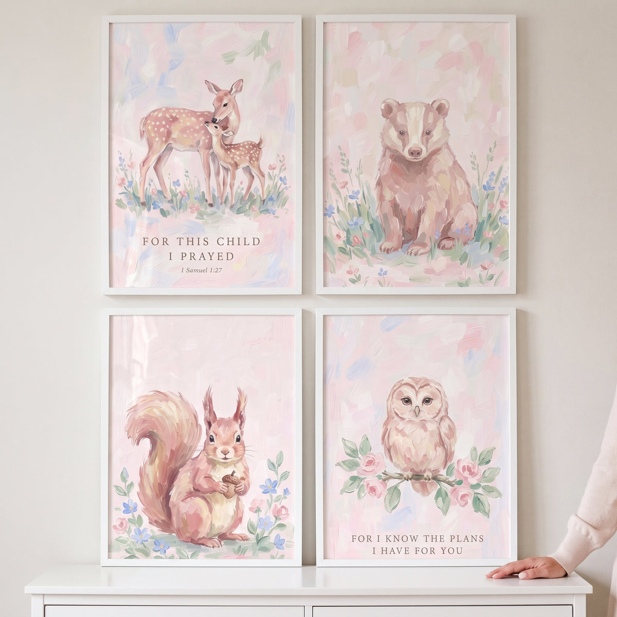 Baby girl woodland animals wall art set of 4 with a deer, bear, squirrel, and owl in soft pink watercolor designs.