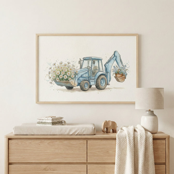 Whimsical nursery wall art showing a blue backhoe holding white daisies and a basket of flowers, mounted above a changing station with soft-toned furniture and decor.