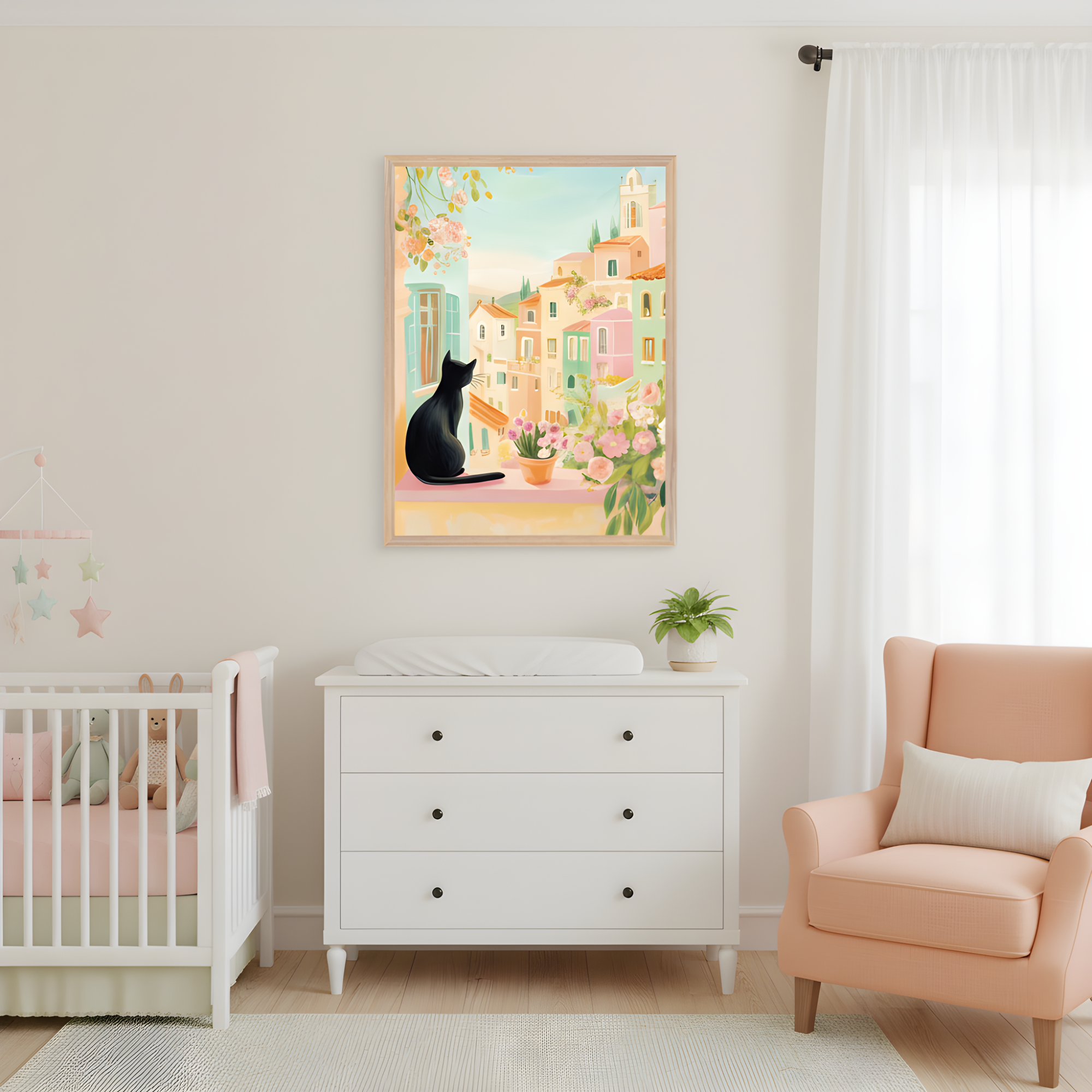 Softly lit nursery features a white crib with plush toys, a white dresser topped with a changing pad, and a peach armchair by a window with sheer curtains. Above the dresser hangs a framed illustration of a black cat gazing out at a pastel-colored hillside village, framed by blooming pink flowers and leafy vines. The space is airy and serene, with gentle tones and whimsical charm.