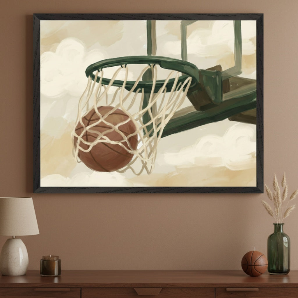 Neutral-toned room with a wooden dresser. A large framed painterly print of a basketball going through a hoop hangs above the dresser. On the dresser are a lamp, candle, small decorative basketball, and a vase with dried grass.