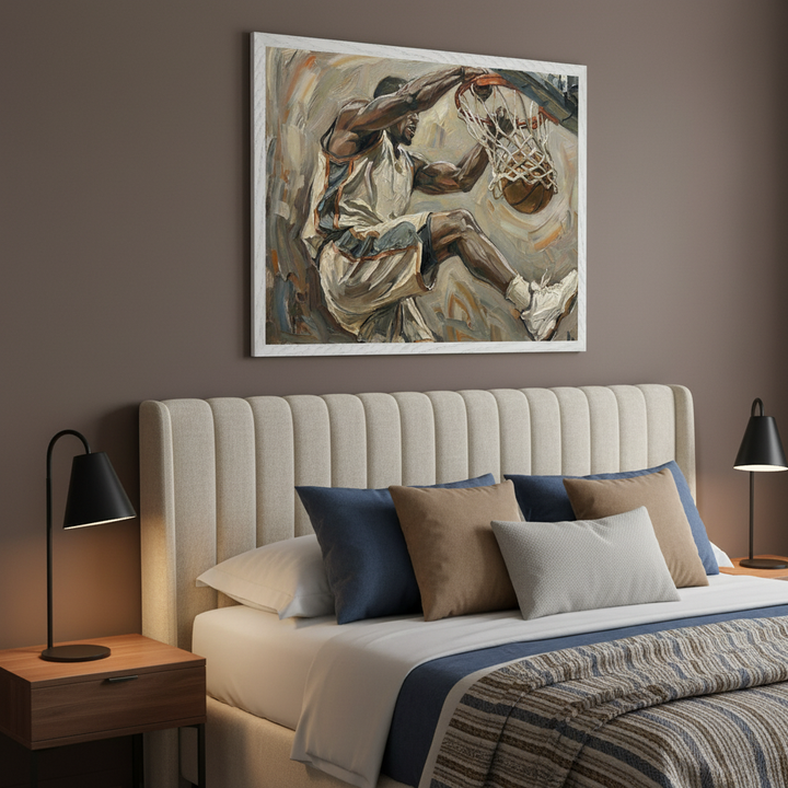 Modern bedroom with a cream upholstered bed. A large framed oil painting of a basketball player dunking a ball hangs centered above the bed.