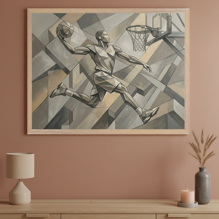 Modern room with a light wood console table. A large framed geometric painting of a basketball player dunking, in muted browns and grays, hangs centered above the table. A lamp and a vase with dry grass are on the table.