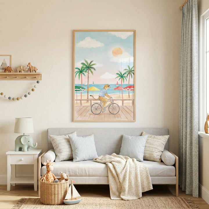 Beach cycling cheetah wall art hanging above a neutral sofa in a cozy nursery with soft decor and an elephant lamp.