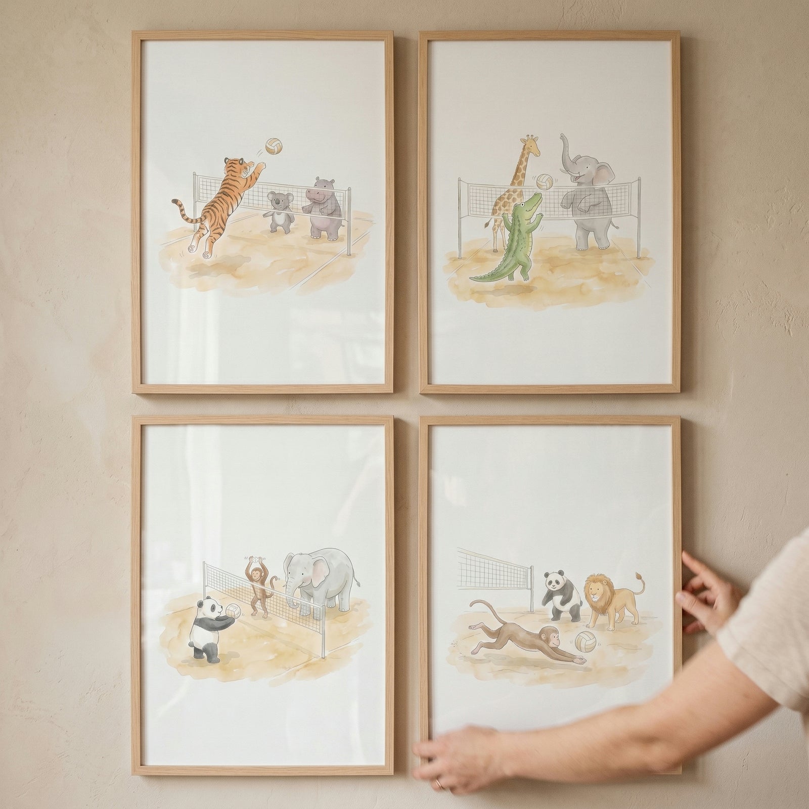 Beach sand volleyball animals wall art set of 4 features watercolor animals playing sports in light wood frames.