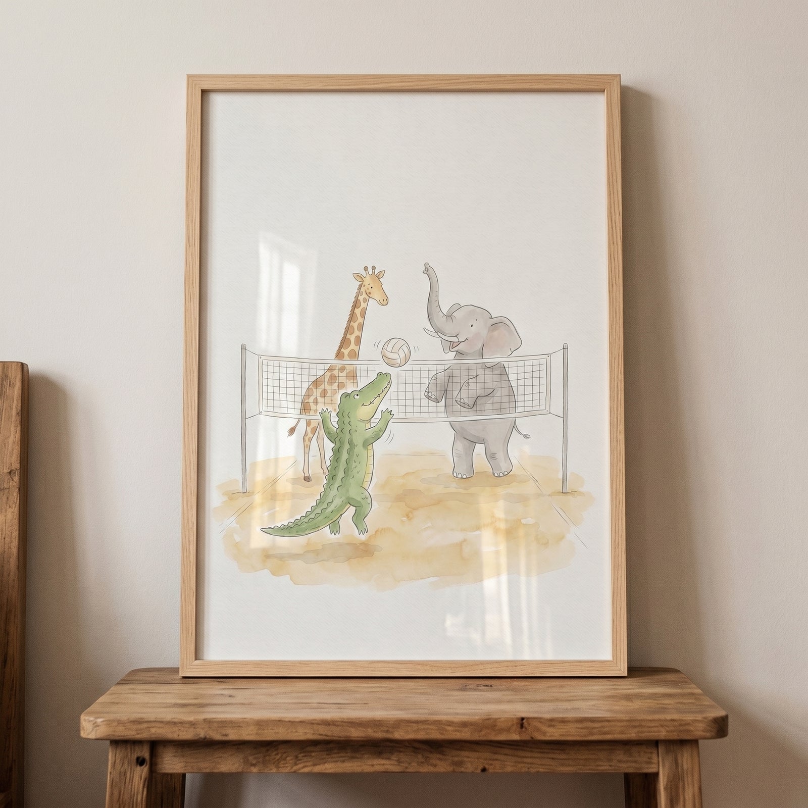 Beach volleyball safari animals wall art in a frame depicts an elephant, giraffe, and crocodile playing together on sand.