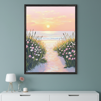 Modern room with a muted teal wall. A large framed painting of a sunset beach path with tall grass and pink and white flowers leading to the ocean hangs above a white console table.