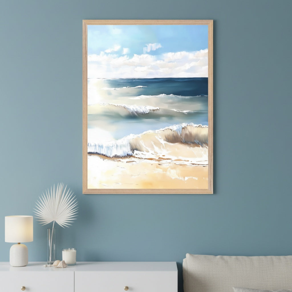Modern living room with a white dresser and partial light sofa. Above the dresser hangs a framed painting of a sunny beach with crashing waves and a blue sky.