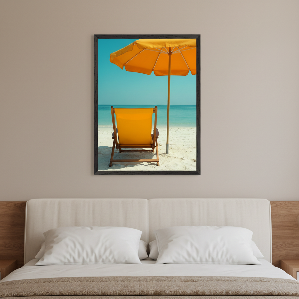Modern bedroom with a beige upholstered bed, flanked by wooden panels. A framed print of a yellow beach chair and umbrella on a sandy beach with blue ocean hangs centered above the bed.