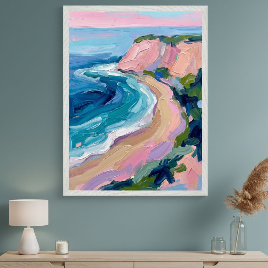 Modern room with a light wood dresser. A large framed impasto painting of a colorful coastal landscape with pink cliffs and blue waves hangs centered above the dresser.