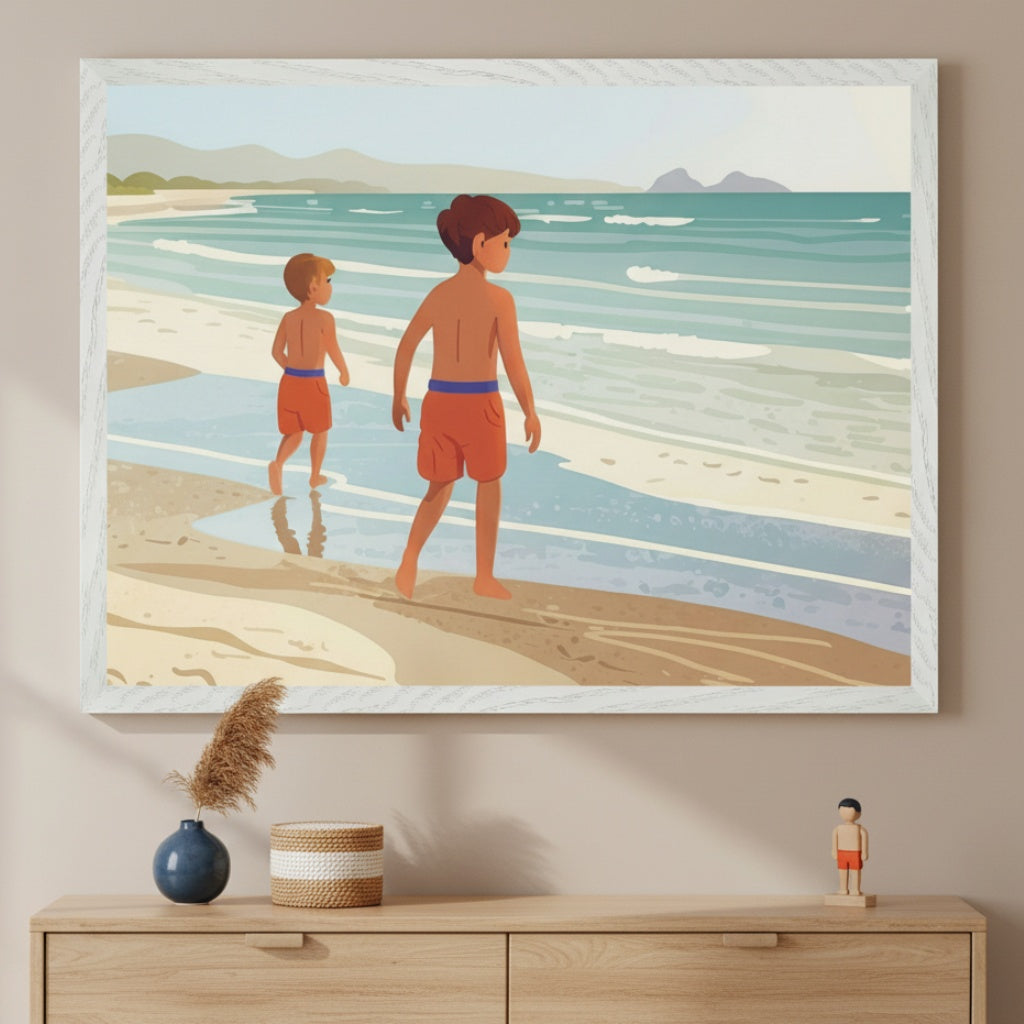 Modern room with a light wood dresser. A large white-framed illustration of two boys in orange swim shorts walking on a sandy beach is centered above it. Mountains are in the background. A vase and woven basket are on the dresser.