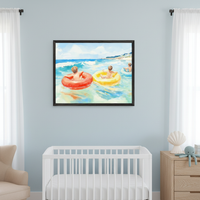 Modern nursery with a white crib, light wood dresser, and beige armchair. A large framed watercolor painting of three kids in inner tubes floating in the ocean hangs on a light blue wall, centered above the crib.