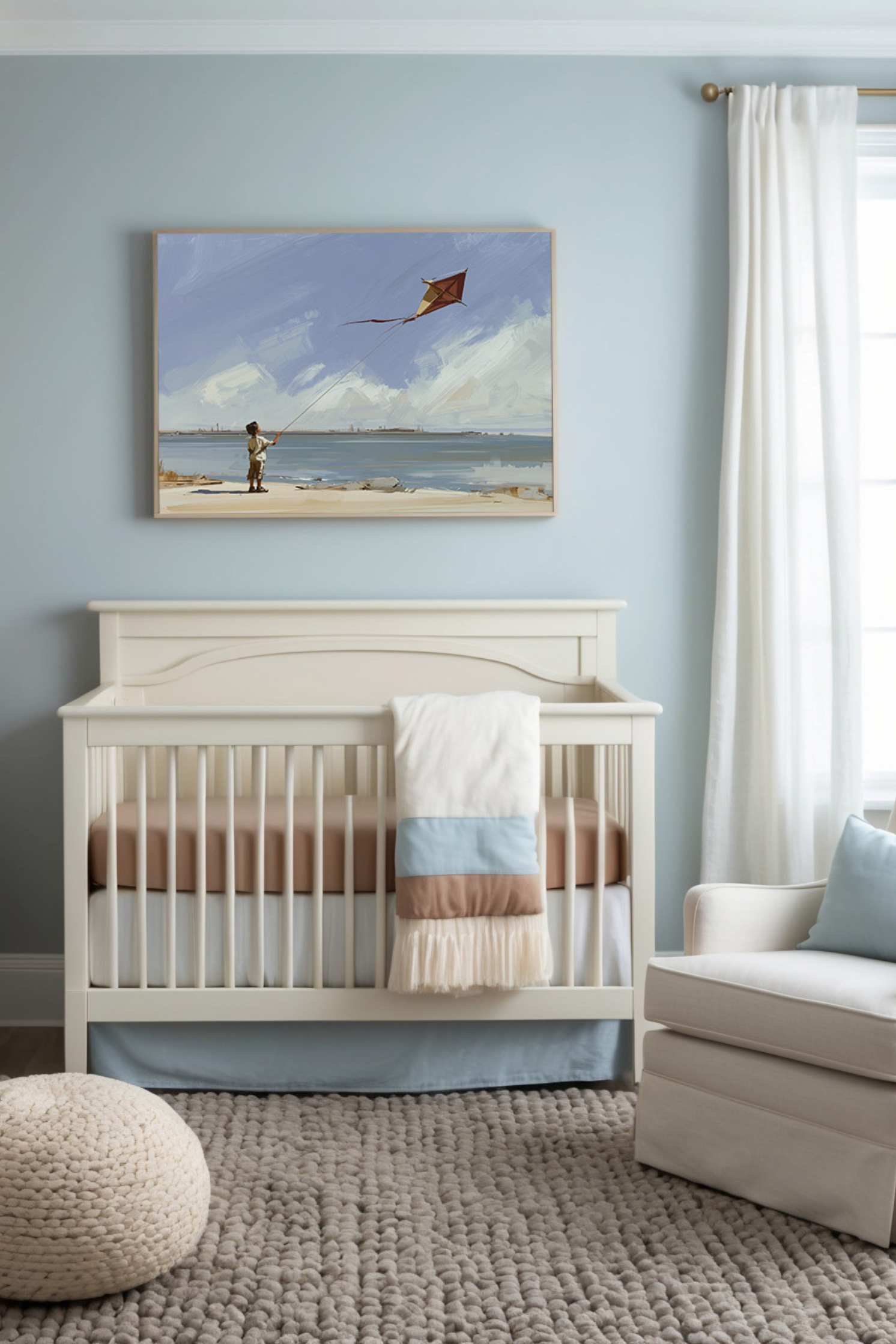 Calming nursery featuring soft neutral tones with a cream crib, pastel bedding, and a plush textured rug. A framed painting above the crib depicts a serene beach scene with a child flying a kite, complementing the room's tranquil aesthetic.