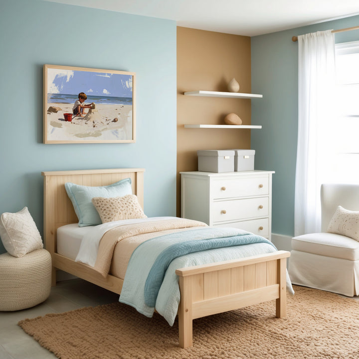 A serene, modern bedroom decorated in soft shades of blue, white, and cream, featuring a neatly made single bed, cozy seating area, white furnishings, and artwork depicting people strolling along a pier towards a small lighthouse.
