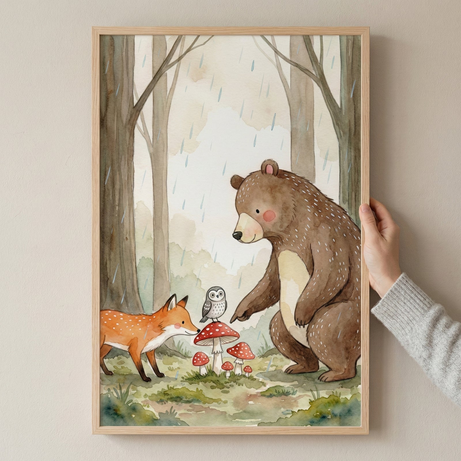 Illustration of a bear pointing at red mushrooms while a curious fox and a small owl look on in a softly raining forest. The scene feels playful and observant, capturing a quiet moment in nature.
