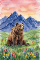 Watercolor illustration of a brown bear sitting in green grass surrounded by colorful wildflowers. Tall blue mountains rise sharply behind the meadow under a warm peach sky. The seated pose gives the scene a calm and grounded feeling.
