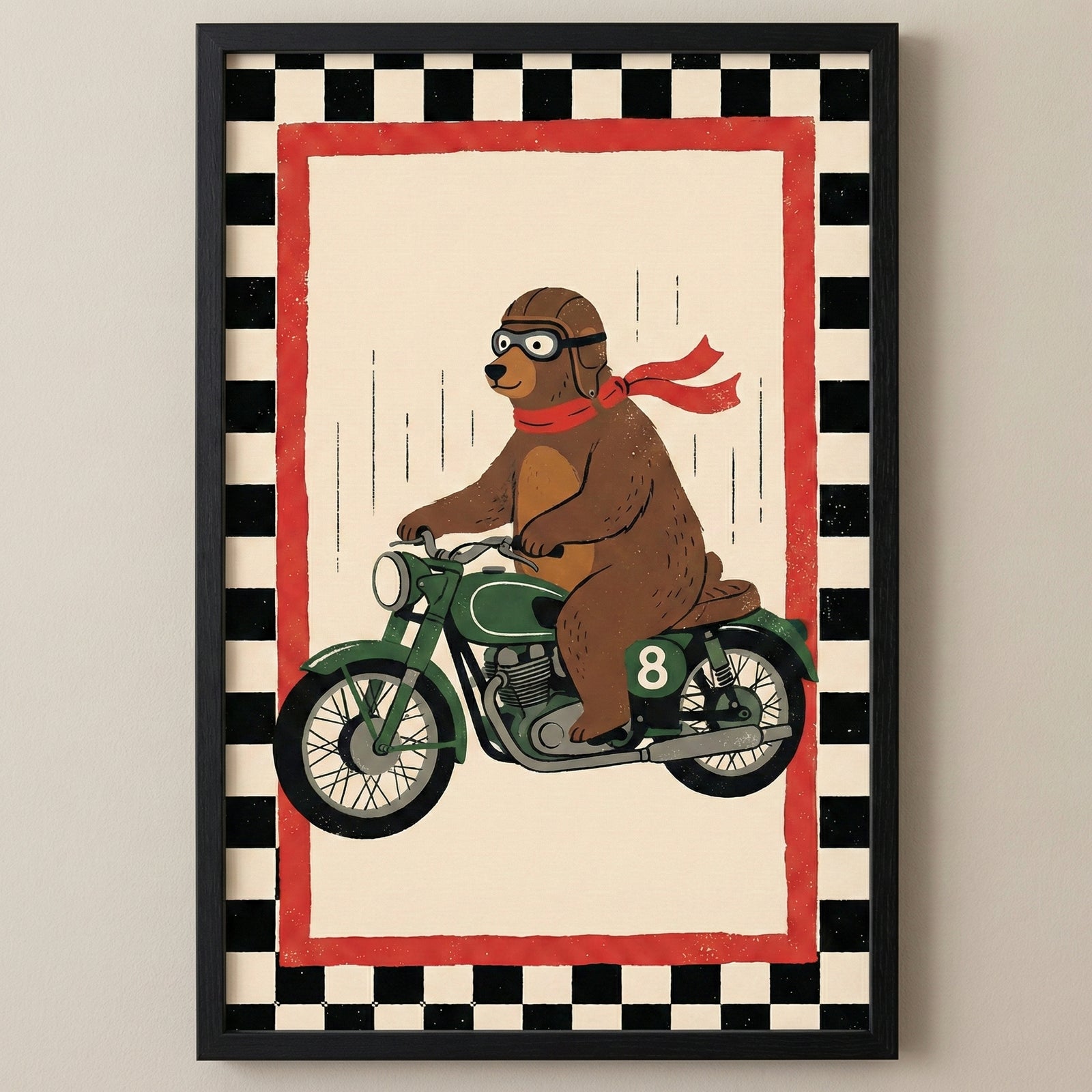 A framed illustration depicts a brown bear riding a green vintage-style motorcycle. The bear is outfitted with a brown aviator helmet, goggles, and a long red scarf blowing in the wind. The motorcycle displays a white number eight on its side. The image is set against a light cream background with vertical dashed lines suggesting movement, all enclosed within a red rectangular border and a wider black-and-white checkered border. The entire work is presented in a black frame.