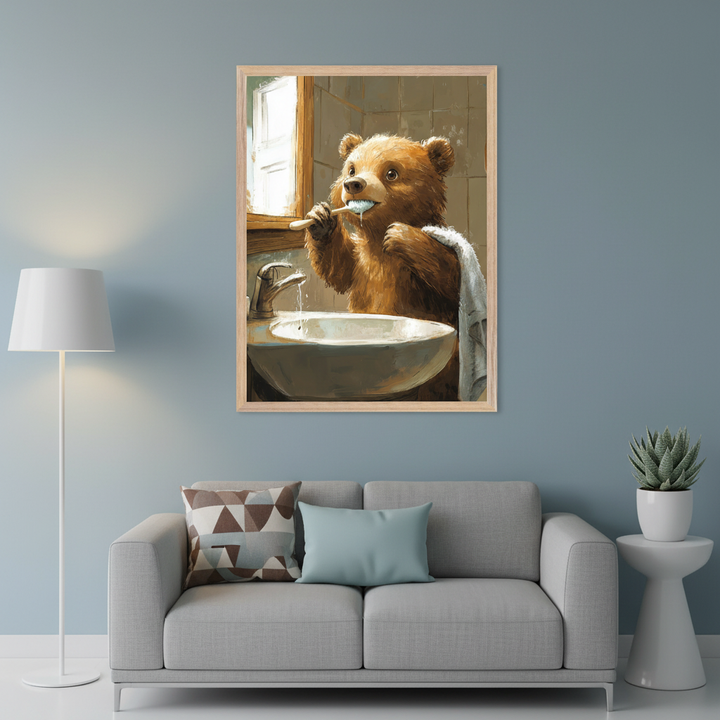 Modern living room with a light gray sofa. A large framed painterly illustration of a brown bear brushing its teeth at a sink hangs centered above the sofa. A white floor lamp is left, a succulent on a side table right.